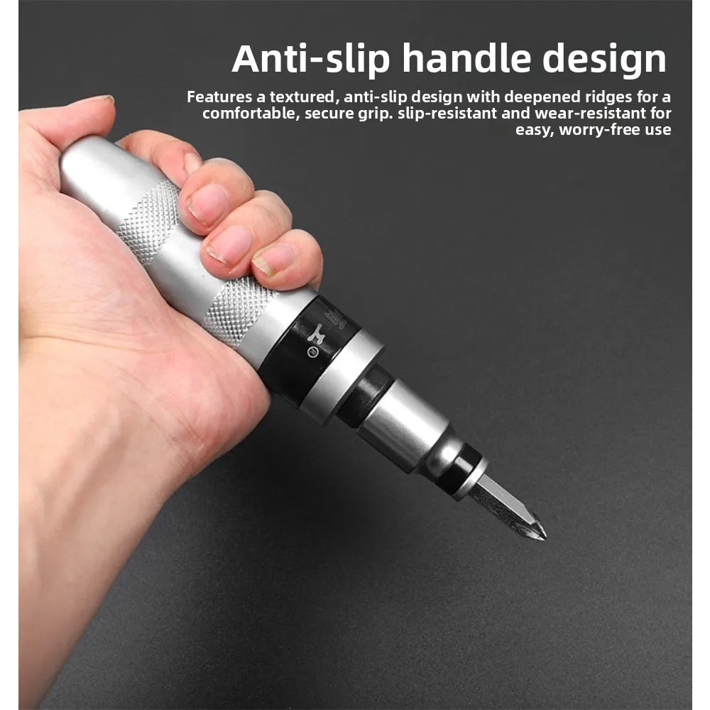 A hand grips a silver precision impact screwdriver with a textured anti-slip handle design.