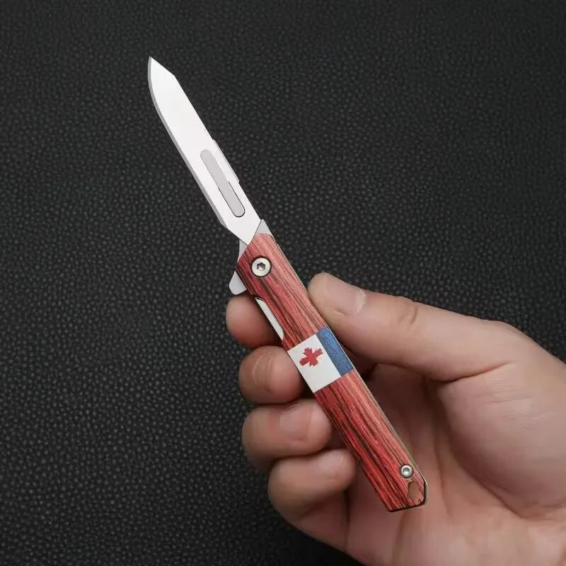 A hand holds a portable utility folding knife with a wooden handle and a silver blade.