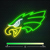 A neon green and yellow outline of a fierce eagle head on a dark textured background.