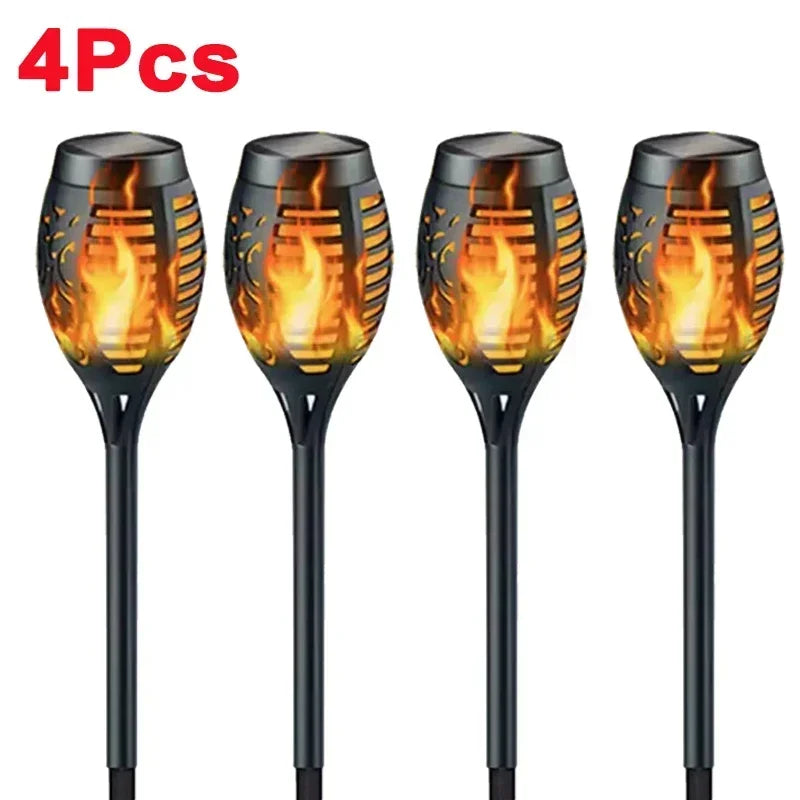 Four black solar flame torch lights for outdoor decoration
