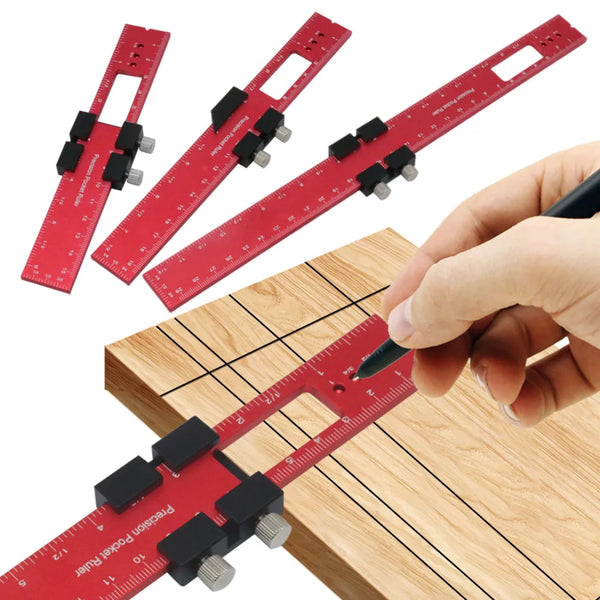 A hand holds a red precision aluminum woodworking ruler against a wooden surface.