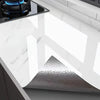 A close-up view of a marble self-adhesive waterproof contact paper installed on a dark cabinet surface.