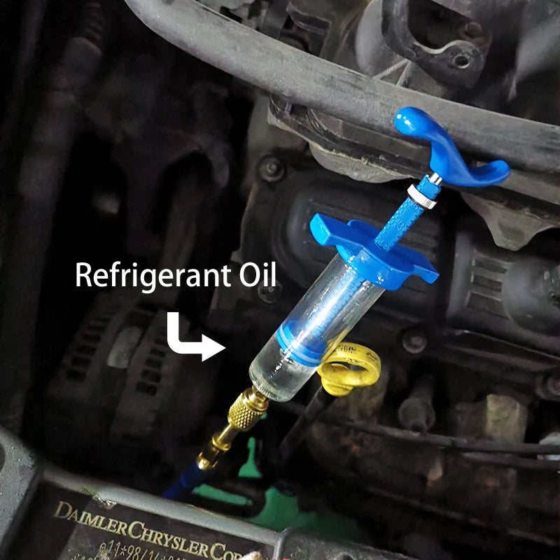 A blue refrigerant oil injector is shown connected to an HVAC system component.