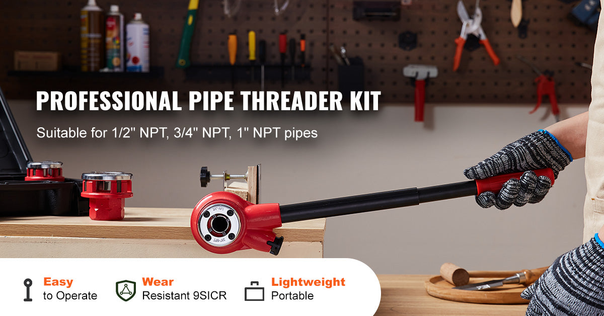 A professional pipe threader kit with a red handle and various sized adapters is shown on a wooden surface.